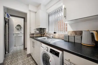 a kitchen with a sink and a dishwasher at Anfield Nest - Air Host & Stay - 3 bed 3 bath in Liverpool