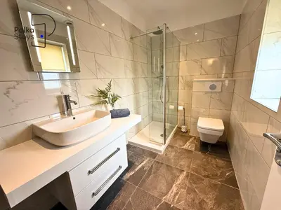 a bathroom with a sink and a shower and a toilet at No 8 PolkaStays Ivy Farm Primrose Deluxe in Brown Moss Side
