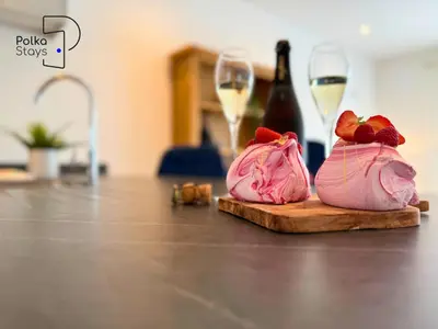 a pair of shoes sitting on a cutting board with wine glasses at No 8 PolkaStays Ivy Farm Primrose Deluxe in Brown Moss Side