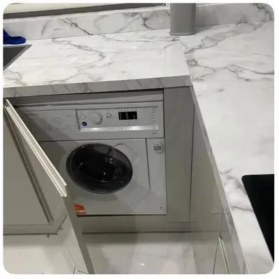 a washer and dryer in a white counter top at Twinhorse in Prescot