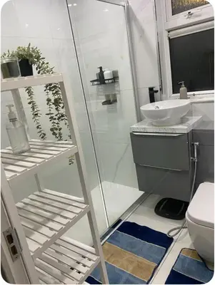 a bathroom with a shower and a sink and a toilet at Twinhorse in Prescot