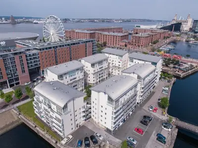 an aerial view of a city with a ferris wheel at 2 bed GF Docklands Apartment - Free Parking for 1 car in Liverpool
