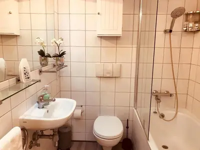 a bathroom with a toilet and a sink and a shower at 2 bed GF Docklands Apartment - Free Parking for 1 car in Liverpool
