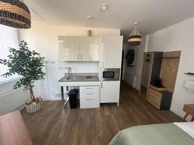 a small kitchen with a sink and a counter at Central 1-Bed Studio Sleeps 2 with City Views in Liverpool