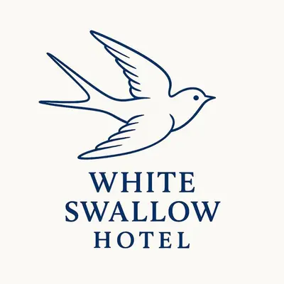a white swallow hotel logo in black and white at White Swallow Hotel in Blackpool