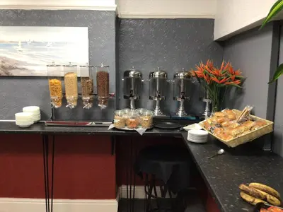 a kitchen with a counter with some food on it at White Swallow Hotel in Blackpool