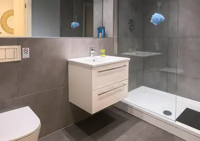 a bathroom with a sink and a shower at Urban Nest Liverpool Near Cavern Quarter sleeps in Liverpool