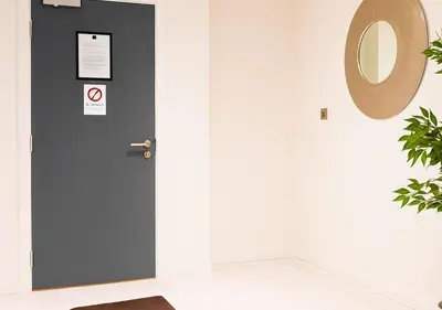 a black door in a white room with a mirror at Urban Nest Liverpool Near Cavern Quarter sleeps in Liverpool