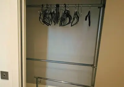 a stainless steel refrigerator with utensils hanging from it at Urban Nest Liverpool Near Cavern Quarter sleeps in Liverpool