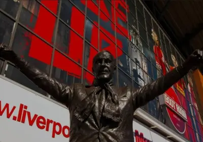a statue of a man with his arms out at Anfield Stadium House - Free Parking in Liverpool