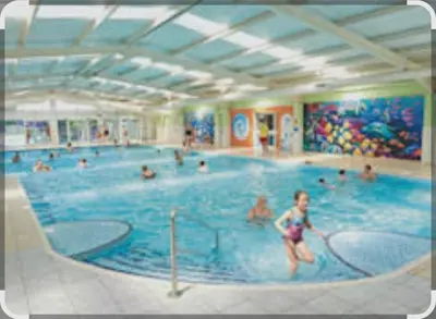 a group of people in a swimming pool at Dennys Holiday Home Pet Free in Blackpool
