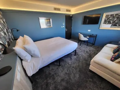a hotel room with a bed and a couch at 272 Accommodation in Blackpool