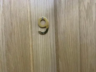 a wooden door with a brass door knocker on it at The Beechwood in Blackpool