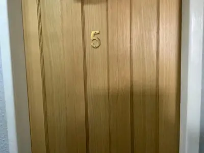 a wooden door with the number on it at The Beechwood in Blackpool