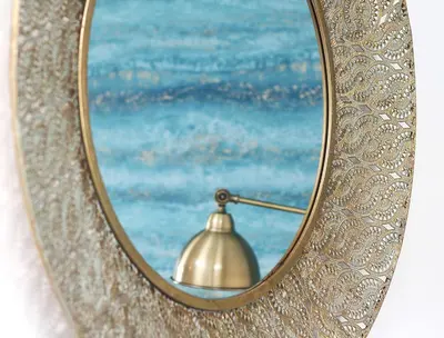 a brass mirror with a lamp in front of it at Lancaster 2 Bedroom House - Driveway Parking in Lancaster
