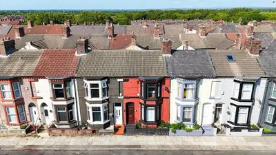 a large group of houses in a city at Sleeps 7- Spacious 3 Bed House w Free Parking in Liverpool