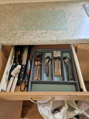 a drawer full of knives and other kitchen utensils at 6 Berth Holiday home near the beach in Morecambe
