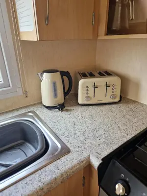 a kitchen counter with a toaster and a toaster at 6 Berth Holiday home near the beach in Morecambe