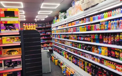 a store aisle filled with lots of toy items at Lodginet Stays - County Luxe - 2BR Flat 1 in Liverpool