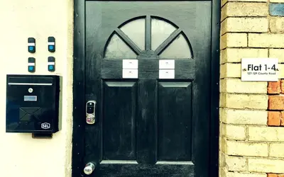 a black door with a sign in front of it at Lodginet Stays - County Luxe - 2BR Flat 1 in Liverpool