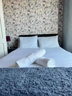 a bedroom with a bed with two towels on it at No1 Lord street in Blackpool