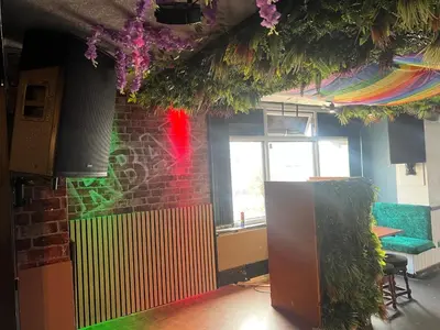 a room with a wall with a rainbow at No1 Lord street in Blackpool