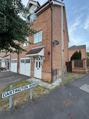 a street sign in front of a brick building at EC Prime Home - Wigan, UK in Ince-in-Makerfield