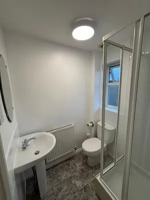 a bathroom with a toilet and a sink and a shower at EC Prime Home - Wigan, UK in Ince-in-Makerfield