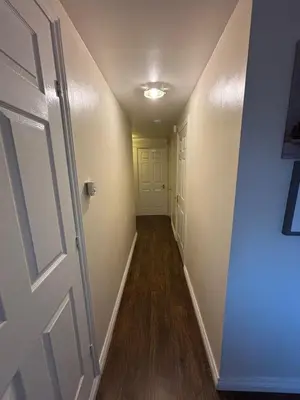 a hallway of a house with a door and a hallway at EC Prime Home - Wigan, UK in Ince-in-Makerfield
