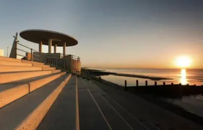 a view of the beach at sunset from a boat at Beach Apartments in Cleveleys