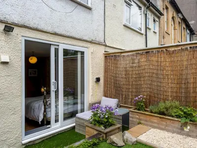 a patio with a sliding glass door leading to a bedroom at Pass the Keys Bright Town-Centre Flat with Outdoor Area in Ulverston
