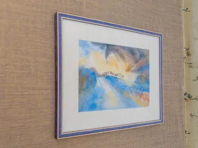 a picture of a painting hanging on a wall at Pass the Keys Bright Town-Centre Flat with Outdoor Area in Ulverston