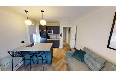 a living room with a couch and a table at 2 Mins to Cathedral Georgian Quarter CityBreak in Liverpool