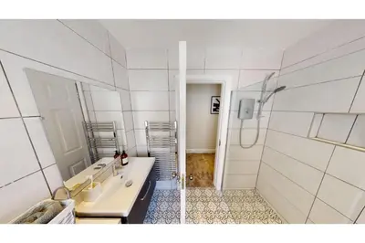 a bathroom with a sink and a shower at 2 Mins to Cathedral Georgian Quarter CityBreak in Liverpool