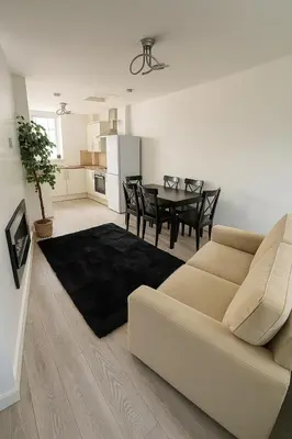 a living room with a couch and a table at New Stylish Modern Home & Free Parking! in Darwen