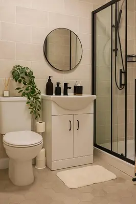 a bathroom with a toilet and a sink and a mirror at New Stylish Modern Home & Free Parking! in Darwen