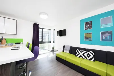 a living room with a couch and a table at Student Only Ensuite at Prospect Point Liverpool in Liverpool