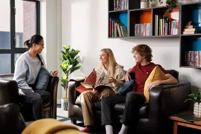 a group of people sitting in chairs in a living room at Student Only Ensuite at Prospect Point Liverpool in Liverpool