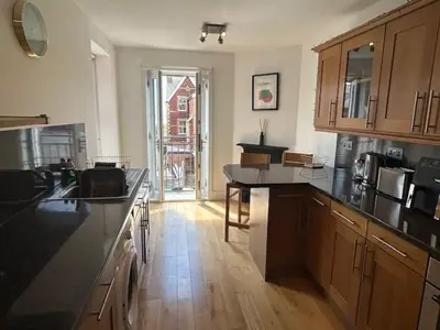 a kitchen with a sink and a counter top at St Annes Spacious Apartment in Saint Annes on the Sea