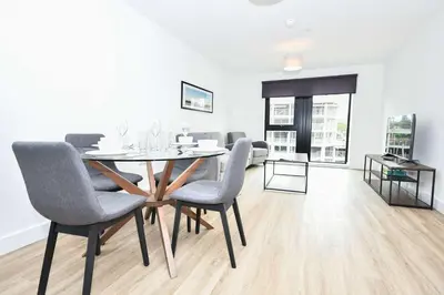 a dining room with a table and chairs at Bright Spacious 2 Bedroom Apartment in Liverpool in Liverpool