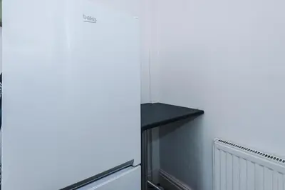 a refrigerator with a shelf on the side of it at 2 Bed Apartment ,Sea Views in Blackpool