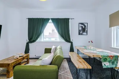 a living room with a couch and a table at 2 Bed Apartment ,Sea Views in Blackpool