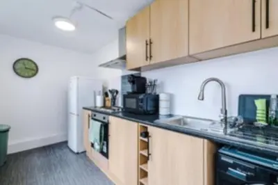 a kitchen with a sink and a counter top at 2 Bed apartment, sleeps up to 5 in Blackpool