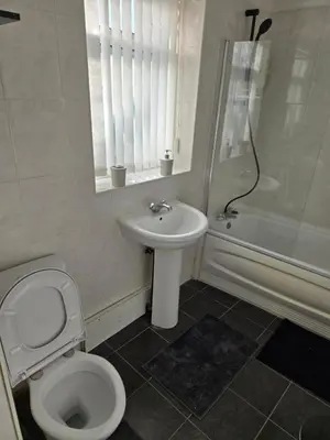 a bathroom with a toilet and a sink and a shower at 2wayz Home in Liverpool