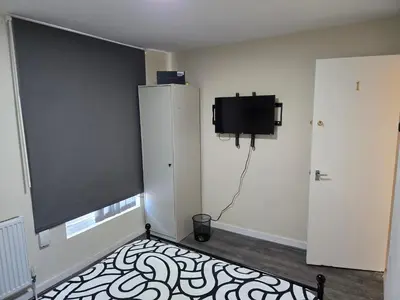 a room with a flat screen tv on the wall at 2wayz Home in Liverpool