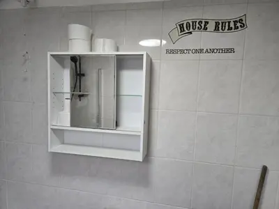 a bathroom with a towel dispenser on a wall at 2wayz Home in Liverpool