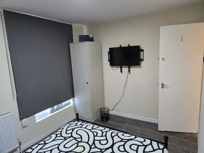a room with a flat screen tv on a wall at 2wayz Home in Liverpool