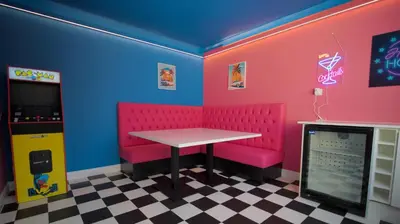 a dining room with pink chairs and a table at Spacious 3-Bed Home - Central Blackpool in Blackpool