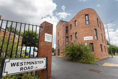 a street sign in front of a brick building at #47 Cozy Anfield Near Stadium Free On-Site Parking in Liverpool