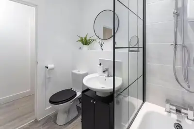 a white bathroom with a toilet and a sink at #47 Cozy Anfield Near Stadium Free On-Site Parking in Liverpool